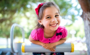 Little girl smiling after children's dentistry visit