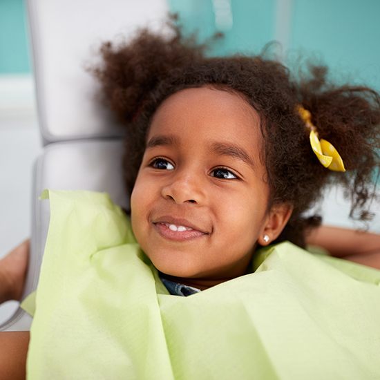 Little girl smiling at children's dentistry checkup