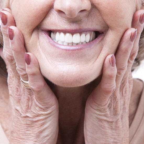 Closeup of woman smiling with dentures in Arvada