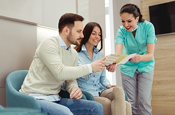 patients discussing the cost of emergency dentistry in Arvada