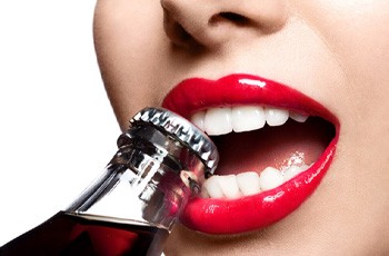opening bottle with teeth prevent dental emergencies in Arvada