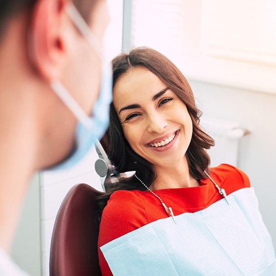 Patient learning about the benefits of dental implants in Arvada