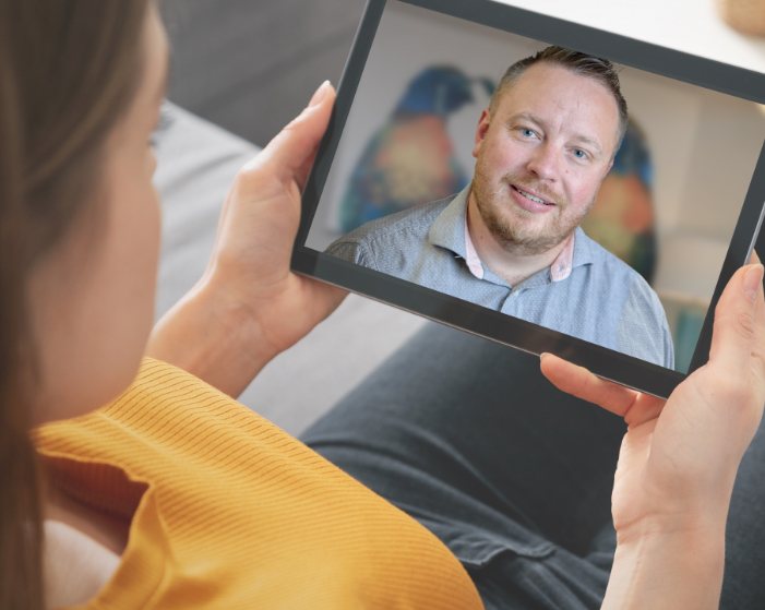 Man looking at his virtual smile design on tablet computer