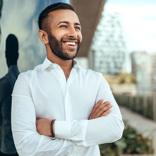 Man smiling outside after nitrous oxide dental sedation visit