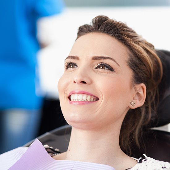 Woman smiling during preventive dentistry checkup
