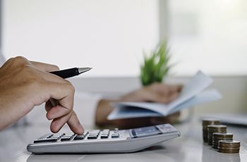 Man calculating cost of veneers in Arvada