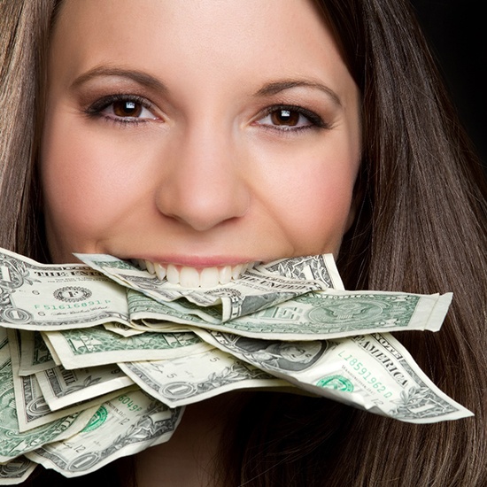 Woman holding money in her teeth