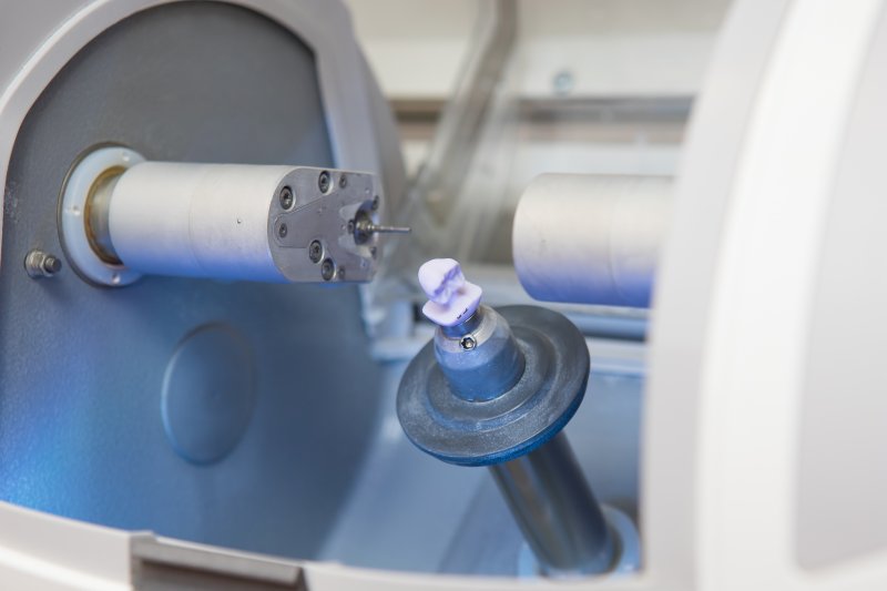 dental crown being milled in a CEREC machine