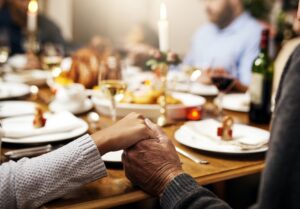 Person with dentures getting ready to eat festive food